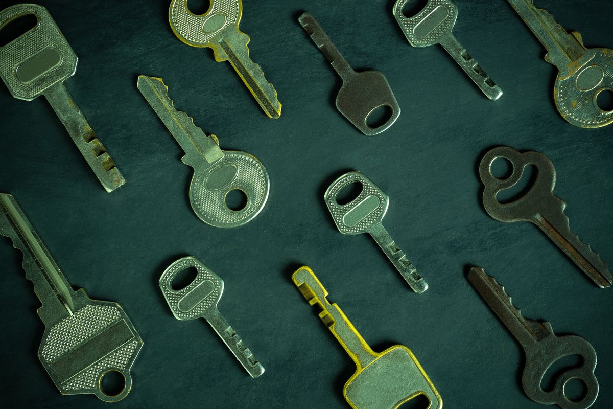 Different keys laying on a surface