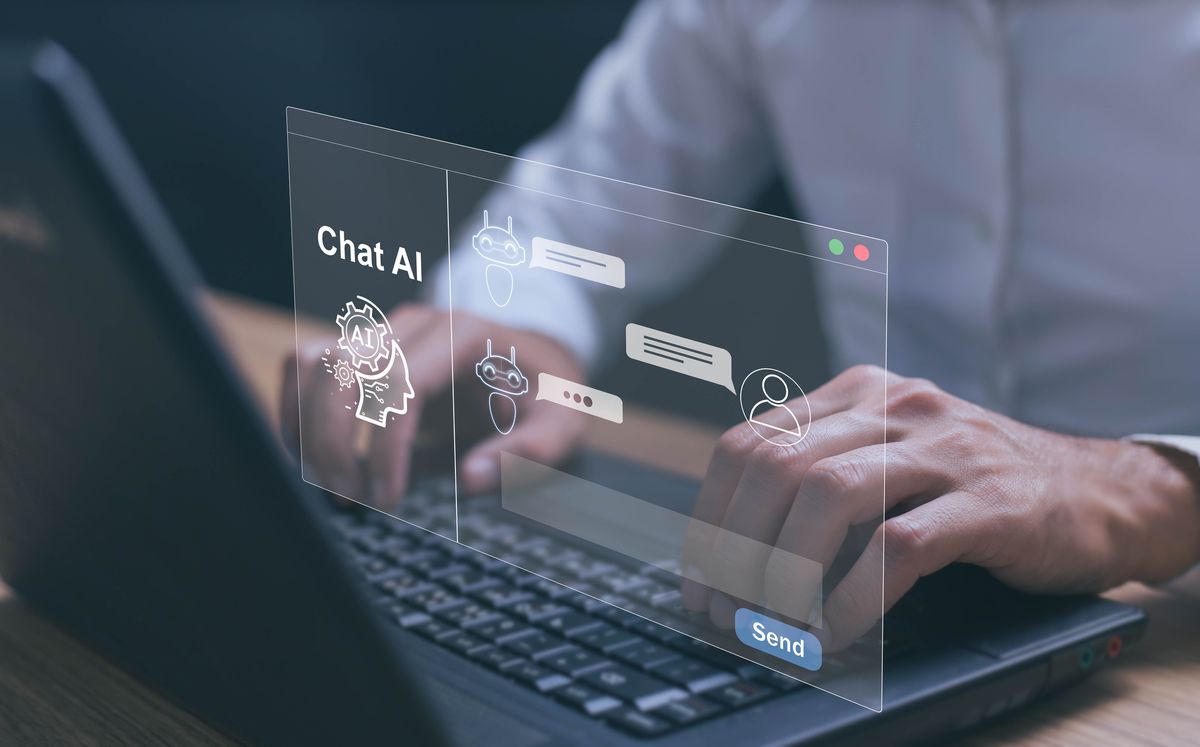 Image of an AI-powered chat interface overlayed on someone typing on a laptop keyboard
